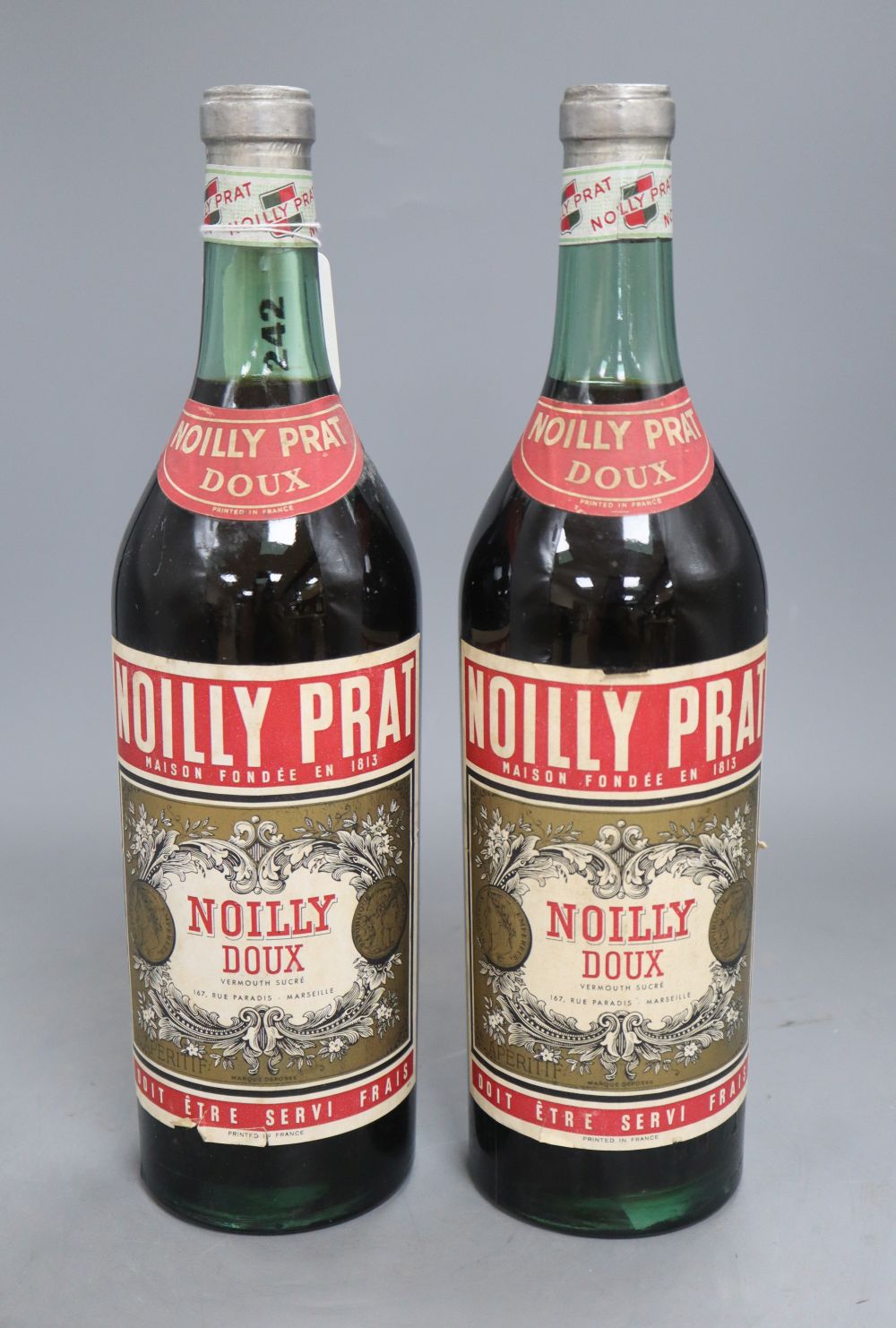 Two 1960s bottles of Noilly Prat Doux